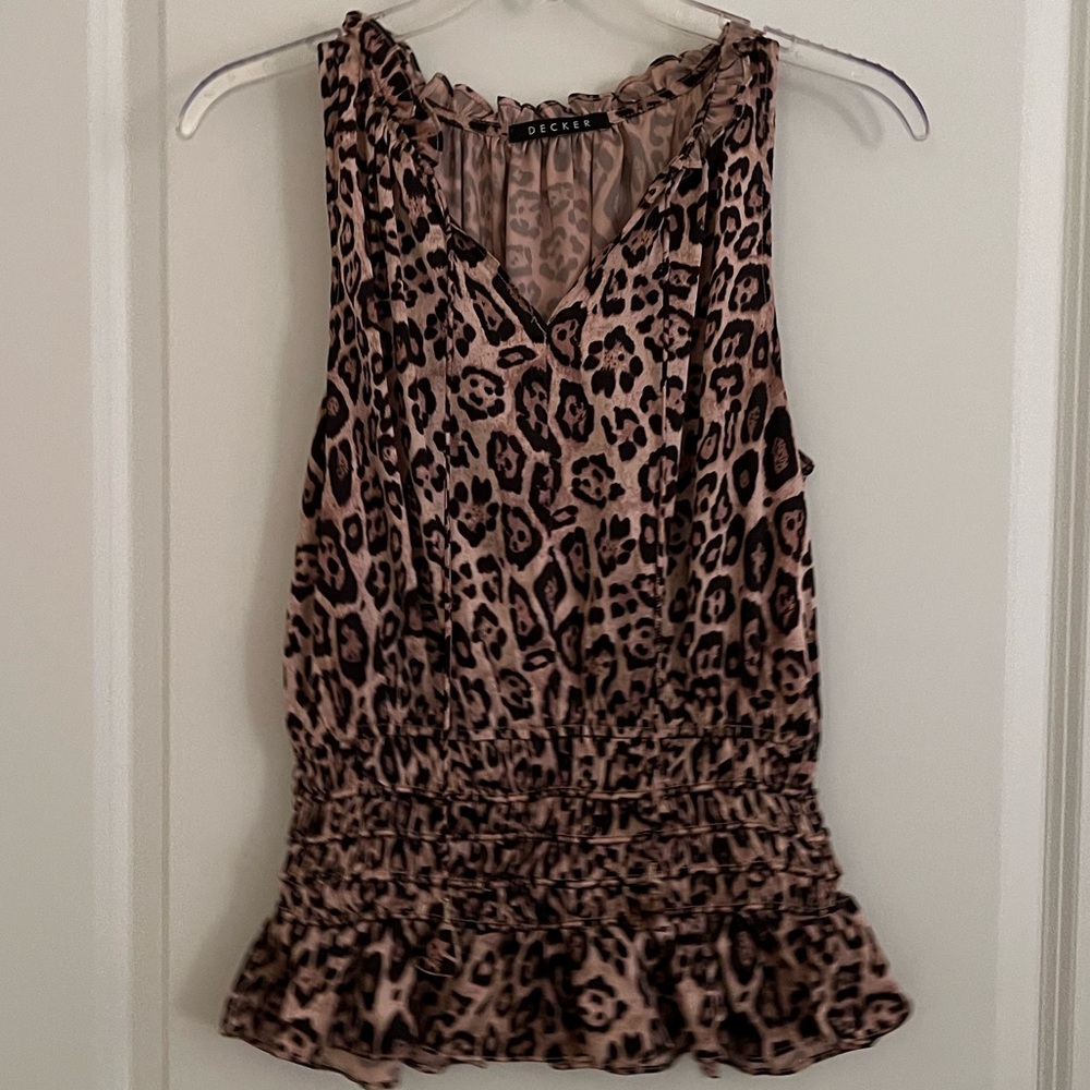 Leopard sleeveless silky top.